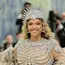 Beyoncé at Met Gala 2026 wearing Olivier Rousteing custom crystal skeleton dress with feathered opera coat and pavé crystal headpiece