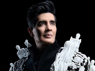 Manish Malhotra at Met Gala 2026 wearing custom black bandhgala and embroidered velvet cape with 3D artisan figurines