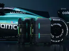 Globe-Trotter x Aston Martin Aramco Formula One Team carry-on in black Vulcanised Fibreboard with Aston Martin Green leather detailing