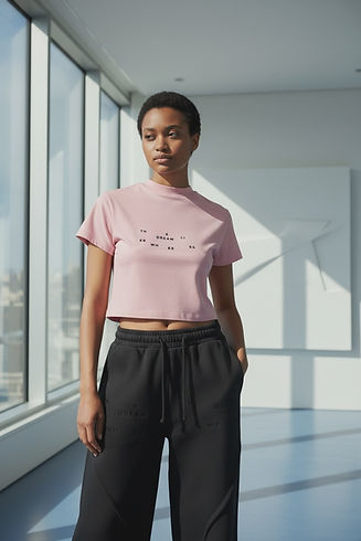 Black girl model wearing a pink slim fit mock neck t-shirt with letters pattern from wherethedreamlies clothing brand  