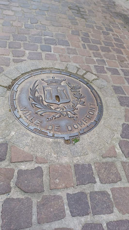 Manhole dover with embossing