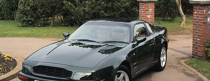 Shiny Black Car in Driveway