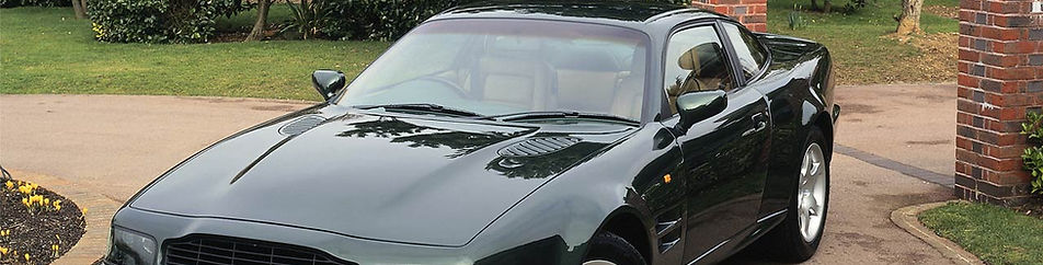 Shiny Black Car in Driveway