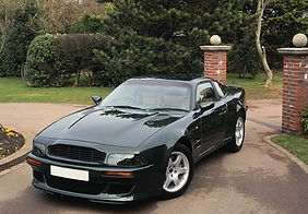 Shiny Black Car in Driveway