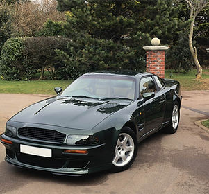 Shiny Black Car in Driveway