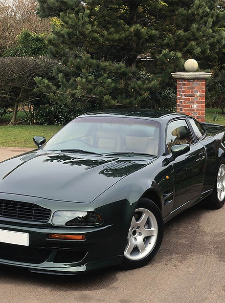 Shiny Black Car in Driveway