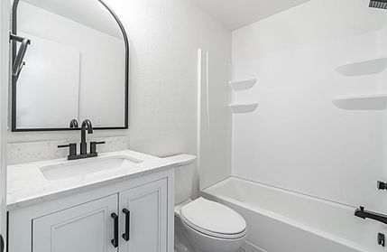 White bathroom with vanity, toilet and shower, modern minimalist interior design.