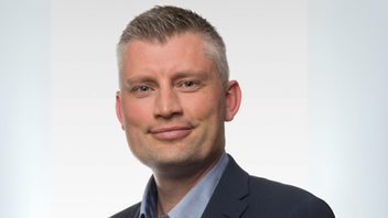 Professional headshot of Jesse Row