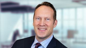 Professional headshot of Kevin Dawson