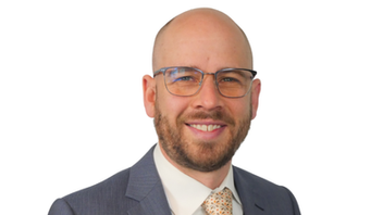 Professional headshot of Cameron Brown
