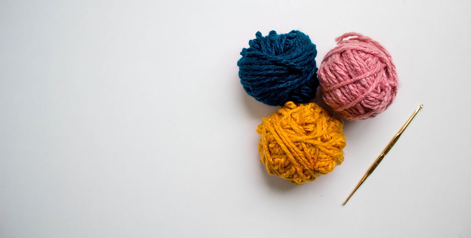 blue%20and%20red%20yarn%20on%20white%20surface_edited.jpg