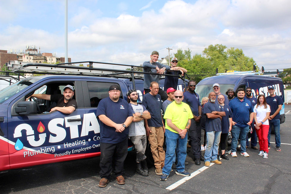 The Stahl Plumbing and HVAC team with their new fleet of fully-equipped vehicles.