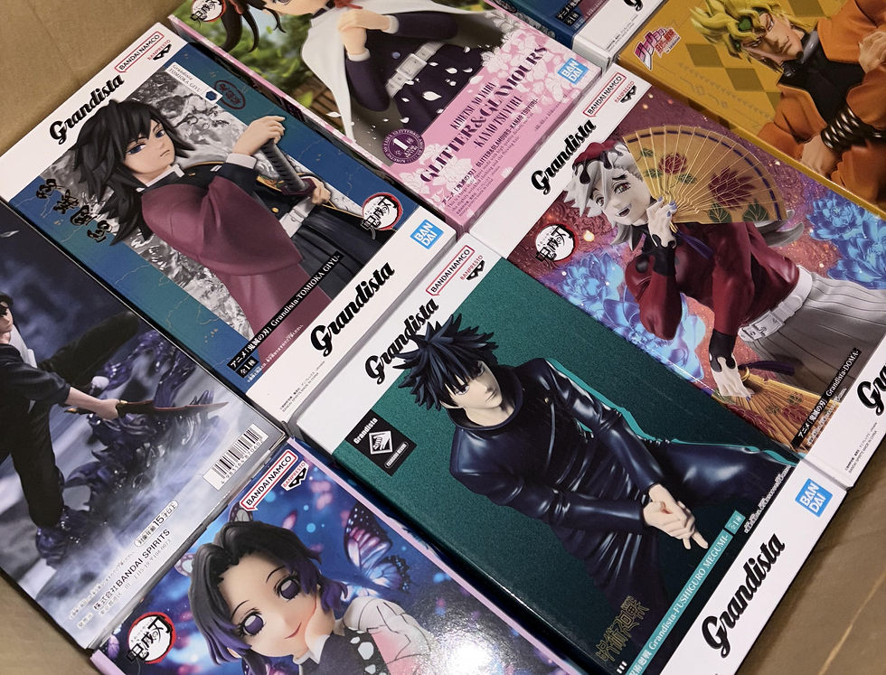 Close-up view of anime figures displayed in a shop