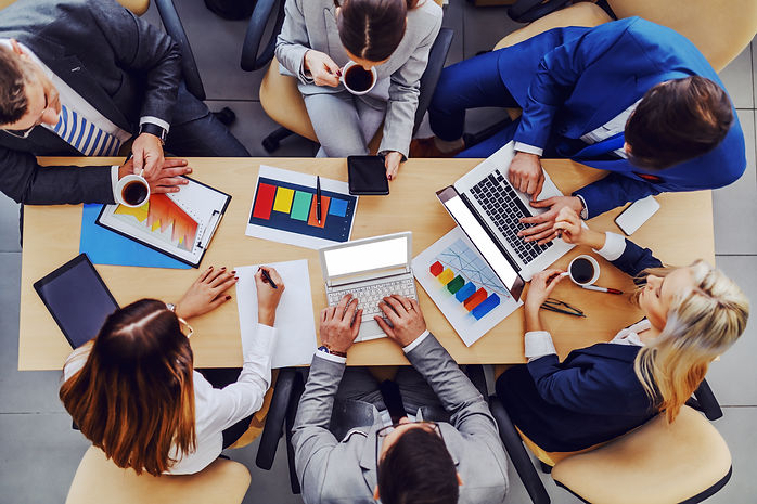 top-view-business-people-sitting-boardro
