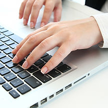 Picture of hands typing on laptop