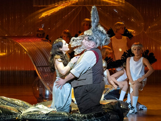 Henry Waddington as Nick Bottom and Daisy Brown at Tytania with the children of A Midsummer Night’s Dream cast as Fairies in Opera North's A Midsummer Night's Dream cr Richard H Smith