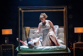Robert Hayward as Scarpia and Giselle Allen as Tosca in Opera North’s production of Puccini’s Tosca. cr James Glossop