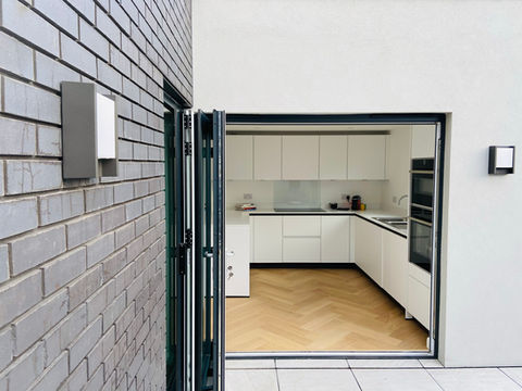 Blue bricks, white render, bi-fold doors, Schuller kitchen, german kitchen, panaget oak heringbone floor, earlham Road, Norwich, Norfolk, ARC Homes