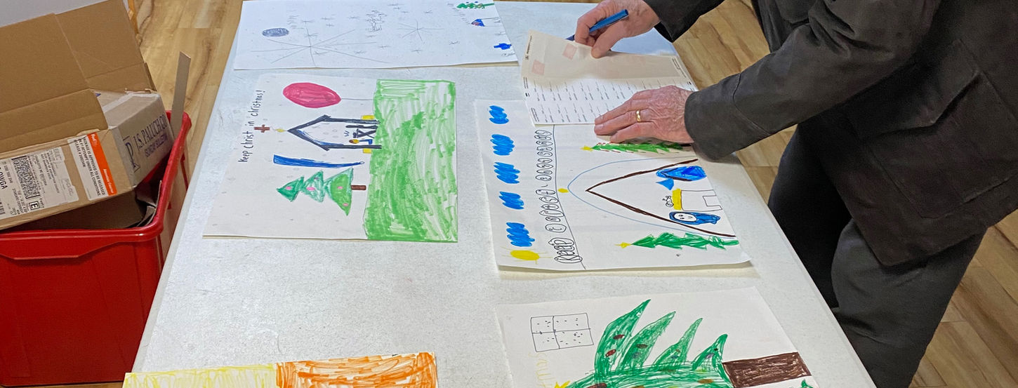 Judges scoring poster entries.