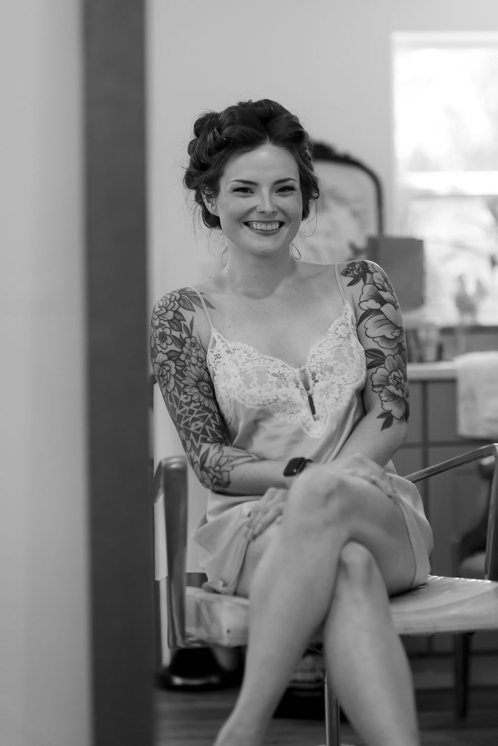 Black and white photograph of Chase getting ready in curlers before her wedding at Adeline Farms in Woodland, Washington.