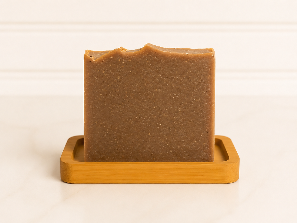 Timber Tar pine tar goat's milk soap on a bamboo dish with marble countertop and white shiplap background.
