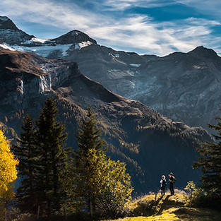 Hikers in Mountainous Landscape
