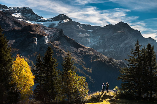 Hikers in Mountainous Landscape