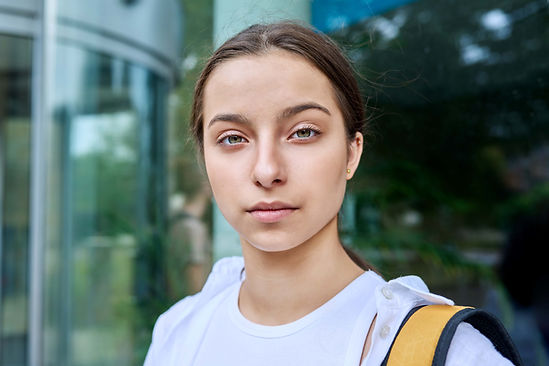 outdoor-portrait-smiling-high-school-student-girl-2023-12-13-08-02-08-utc-min.jpg