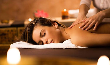 Woman receiving a relaxing back massage at a spa.