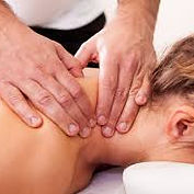 Therapist applying therapeutic bodywork to a woman's neck.