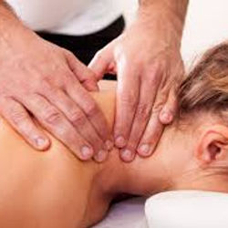 Therapist applying therapeutic bodywork to a woman's neck.