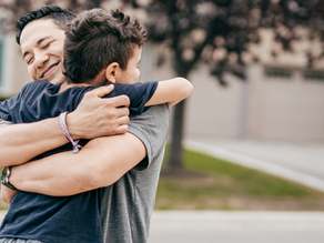 Parent and child hugging