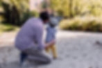 father and son looking at something in the distance