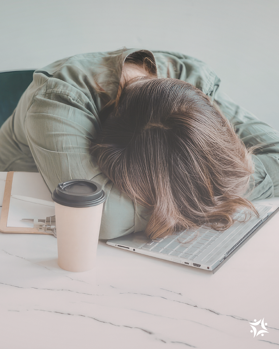 woman overwhelmed on her desk