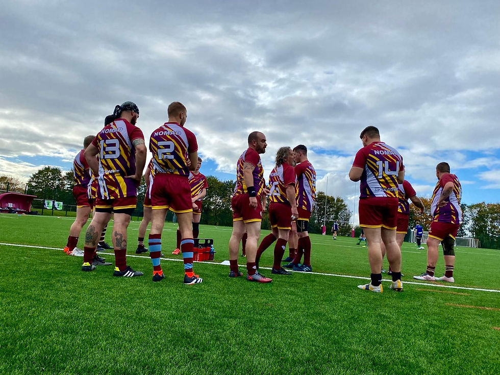 Sports team members gathered on a green field