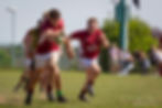 Rugby player running with ball during a match