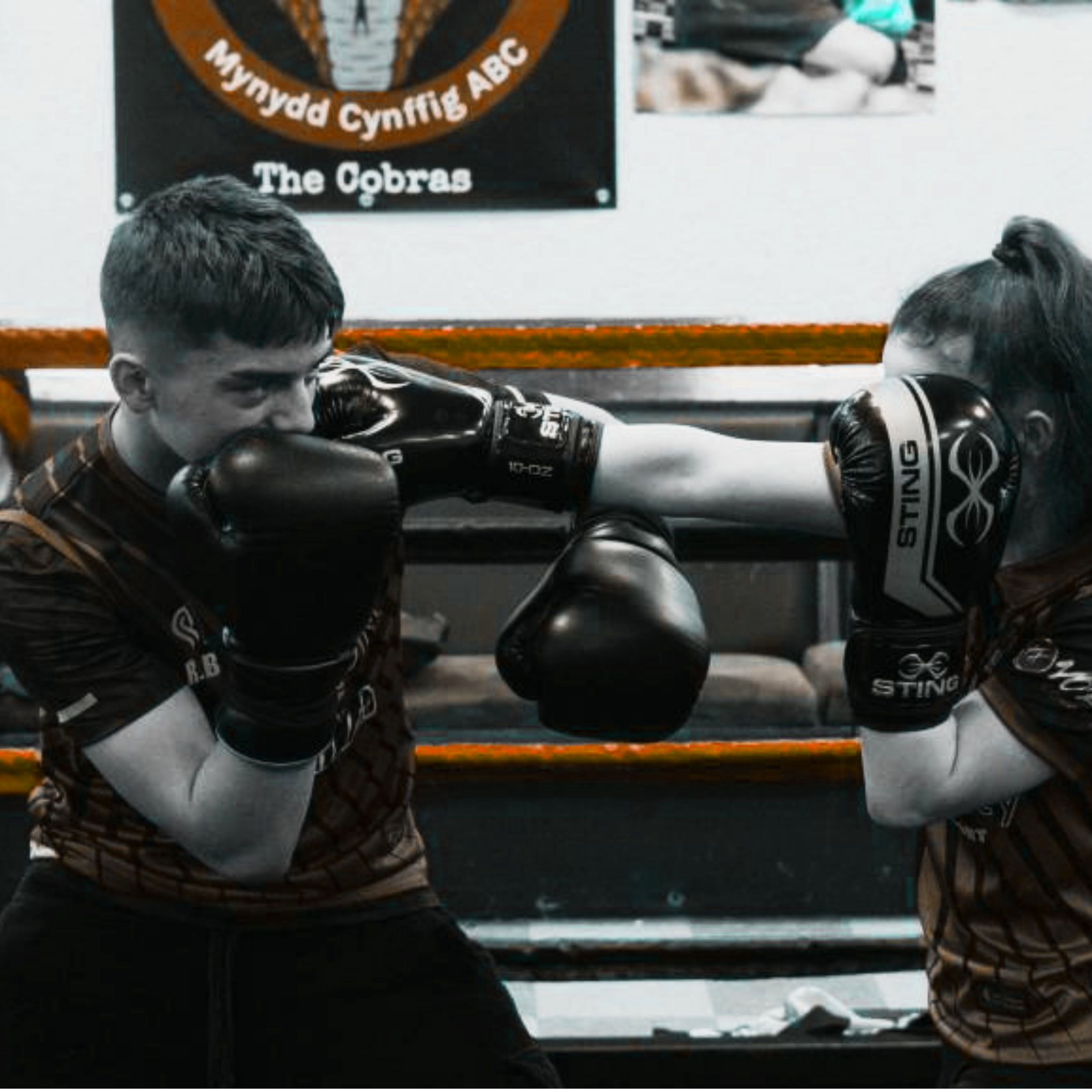Two boxers sparring in a boxing ring at Mynydd Cynffig ABC