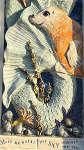 seal and murmaid tail and text created in clay with words about the sea