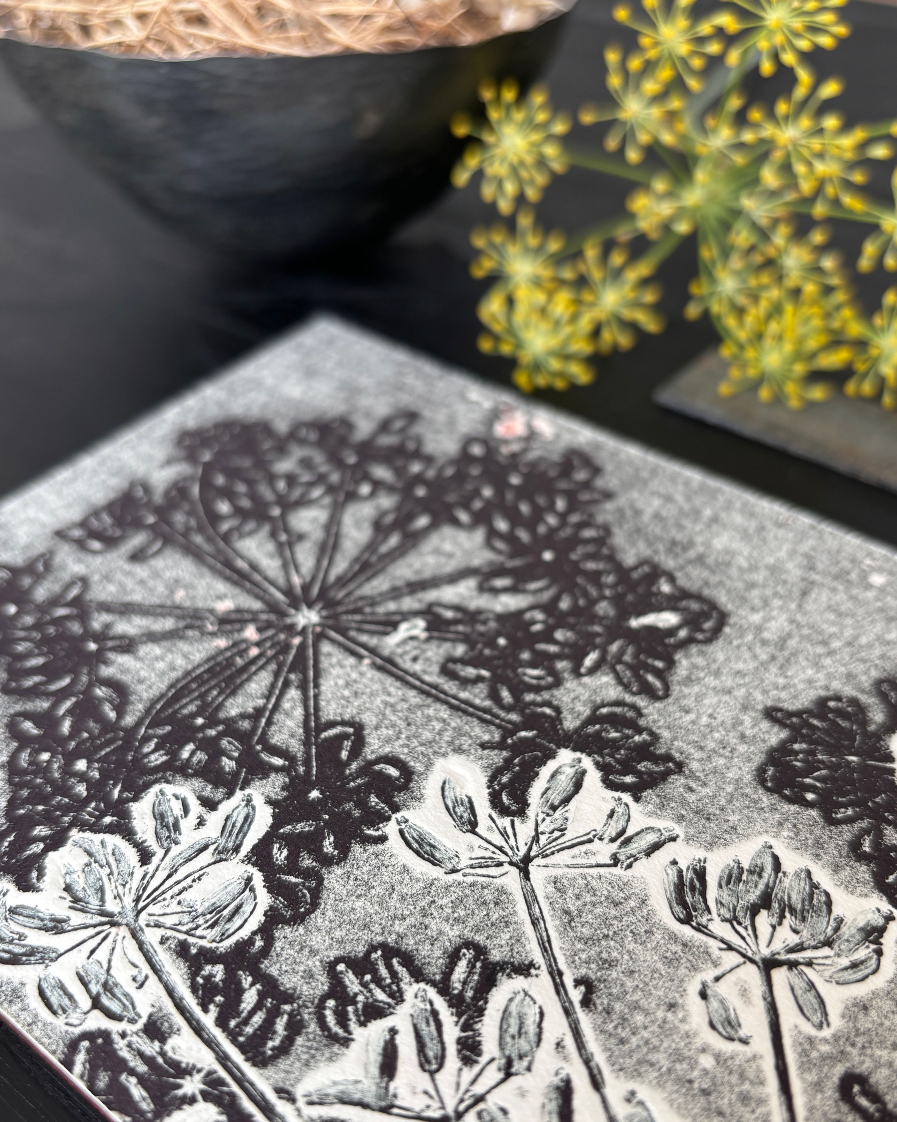 Close-up image showcasing a detailed monoprint featuring intricate fennel plant designs by Su France Designs. The print displ