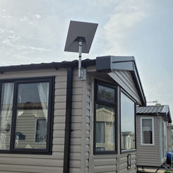 Starlink satellite dish installation on a holiday caravan at a North Wales caravan park