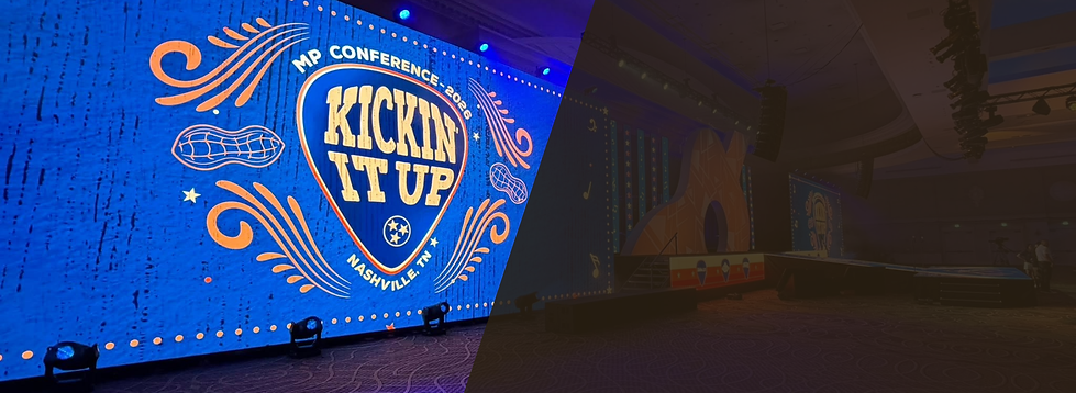 Corporate conference stage with large LED video wall ad evet lighting.