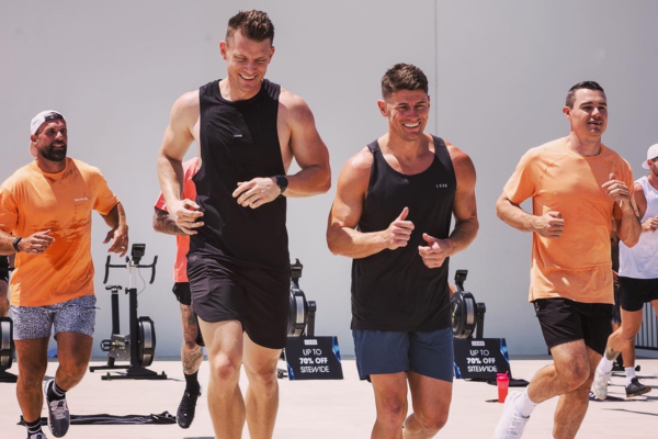 Wide angle view of a fitness class in a boutique studio, showcasing dedicated participants