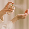 perfume-being-sprayed-onto-wrist.jpg