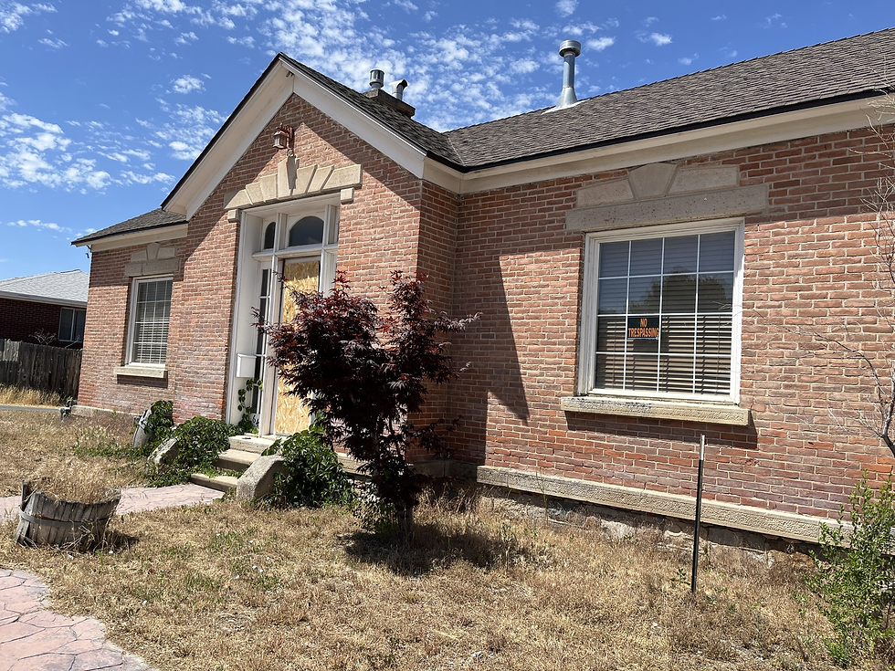 A more recent photo. Notice the stone foundation and hand-worked stone lining above the foundation and above windows and the door
