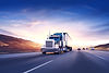 American style truck on freeway pulling load. Transportation theme. Road cars theme._edite