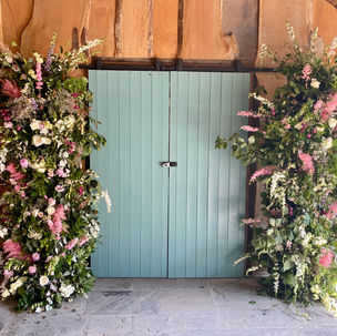 Floral Towers each side of barn doors