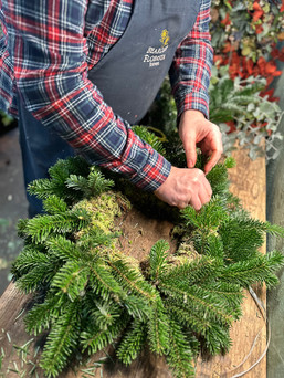 Foliaged moss ring and hand