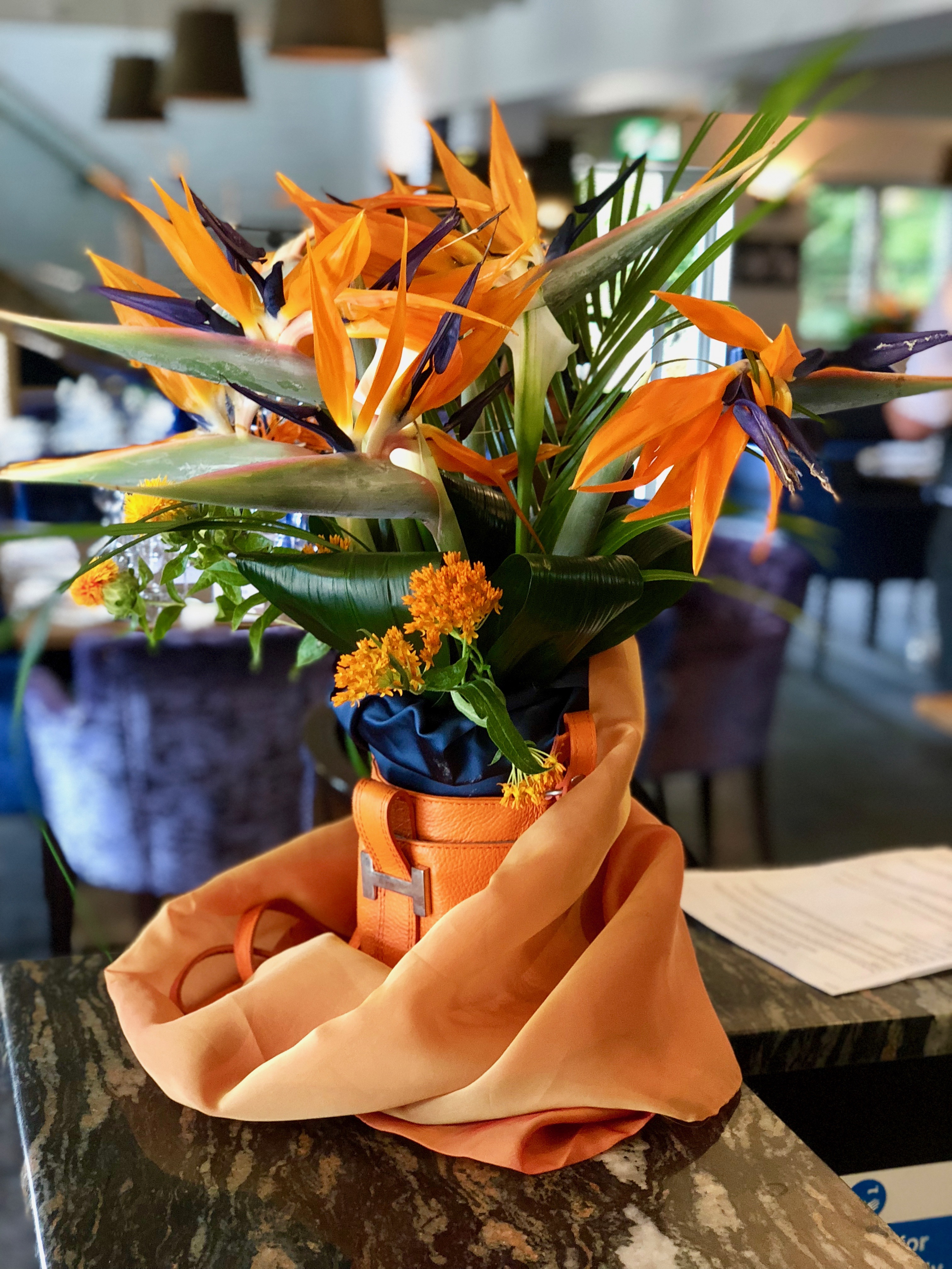 Strelitzia and Leather Bag