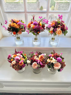6 bridesmaid posies with oink and orange autumnal flowers