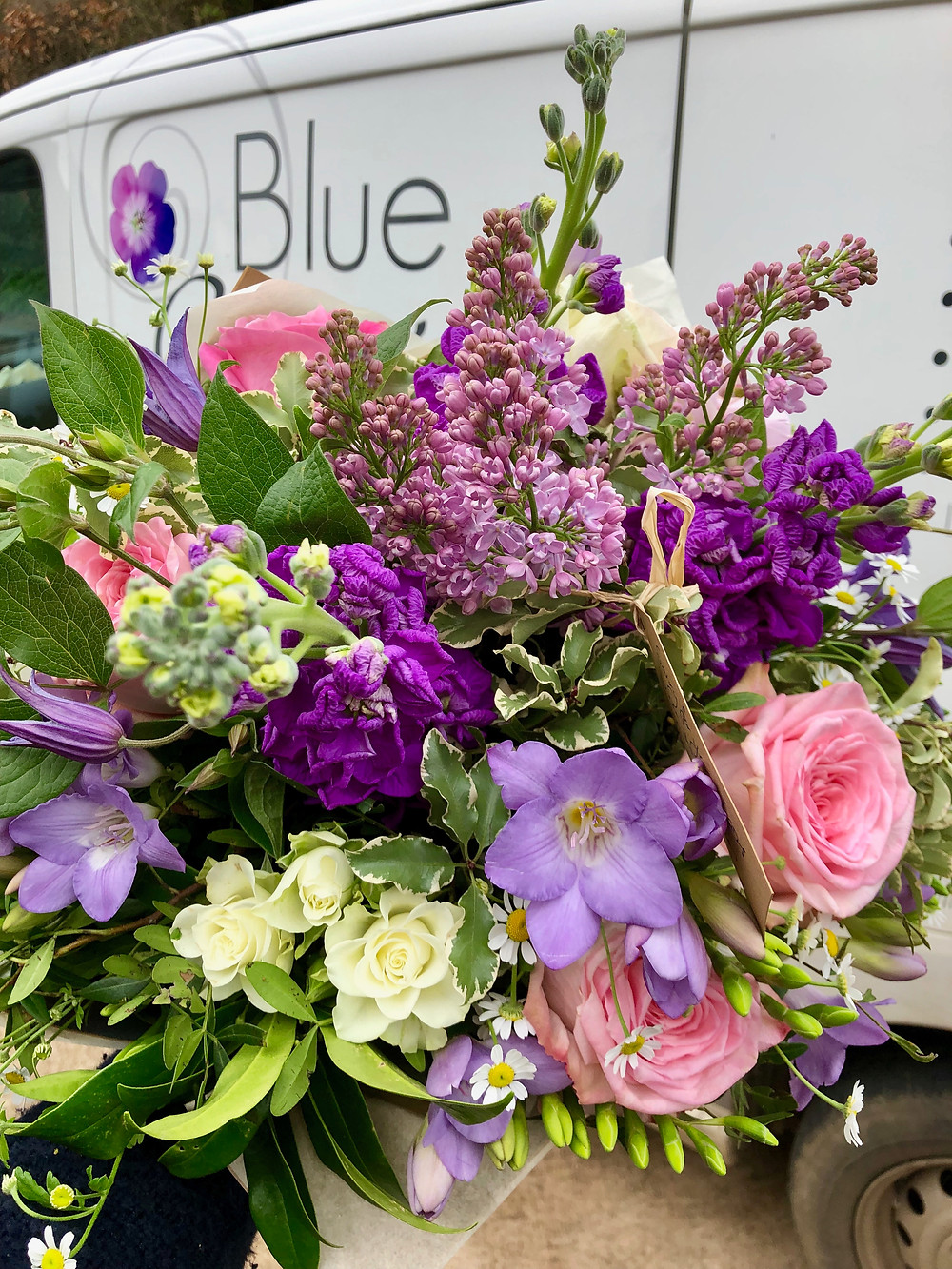 fresh flowers, hand-tied bouquet, lilac, roses, freesias, stocks, vehicle, van Blue Geranium logo